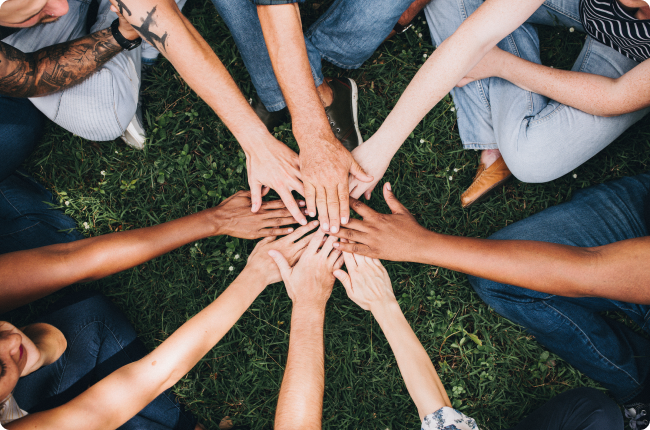 People stacking hands